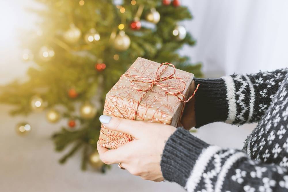 Woman giving a holiday gift