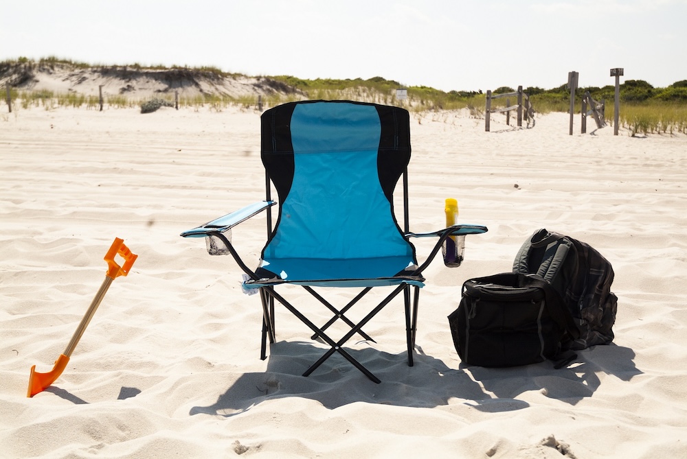  Beach chair in the sand on a calm beach