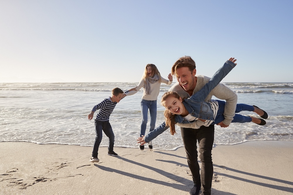 family having fun on Oak Island beach