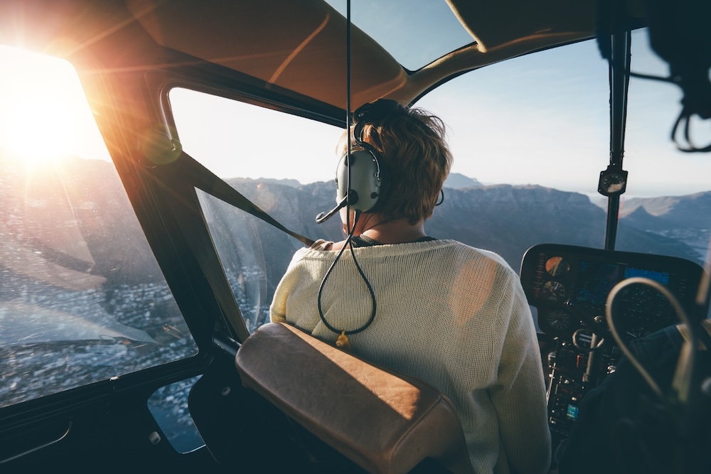 woman viewing beach during helicopter tour